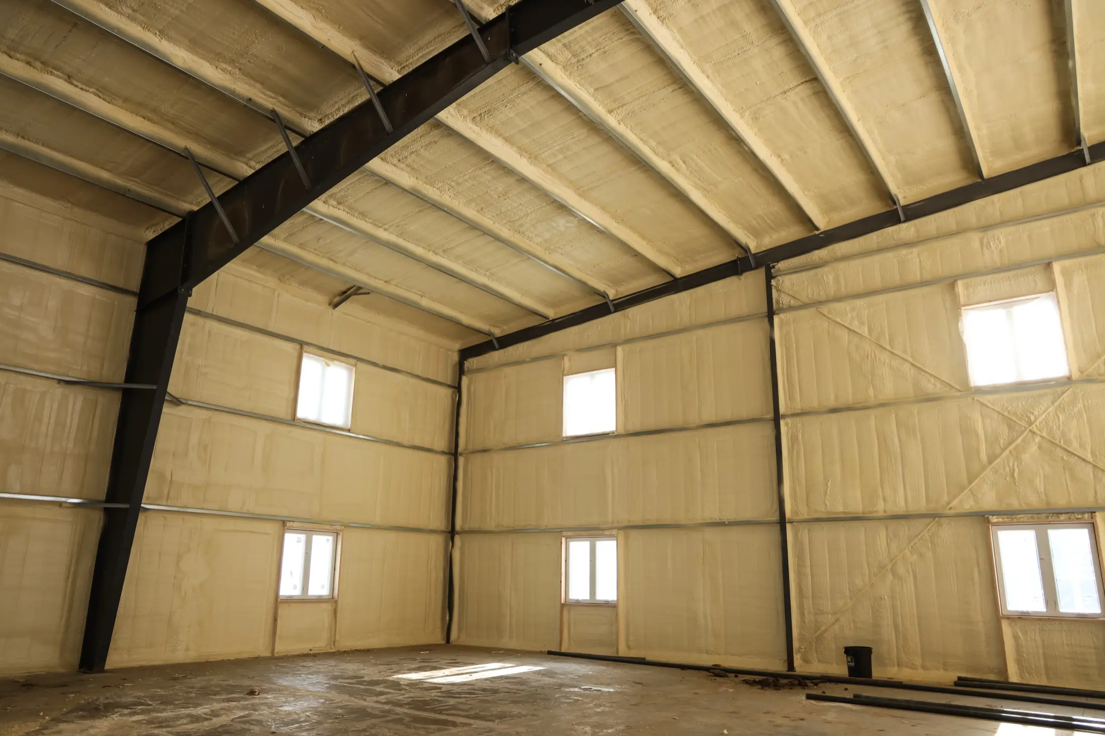 Wall cavity metal building insulation application